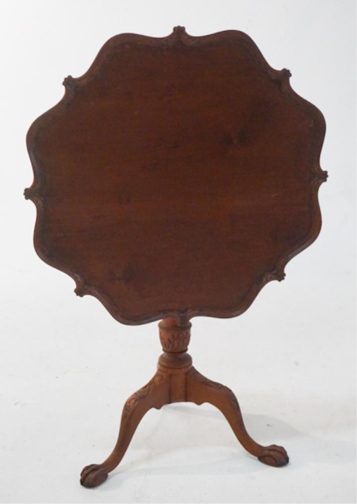 Chippendale Style Carved Mahogany TiltTop Tea Tabl: Mid to late 19th century. Having a nicely shaped, figured and carved top above turned base emitting three acanthus carved legs ending in a ball and claw foot. H28 1/4" W28 1/4" Sold from the collectio