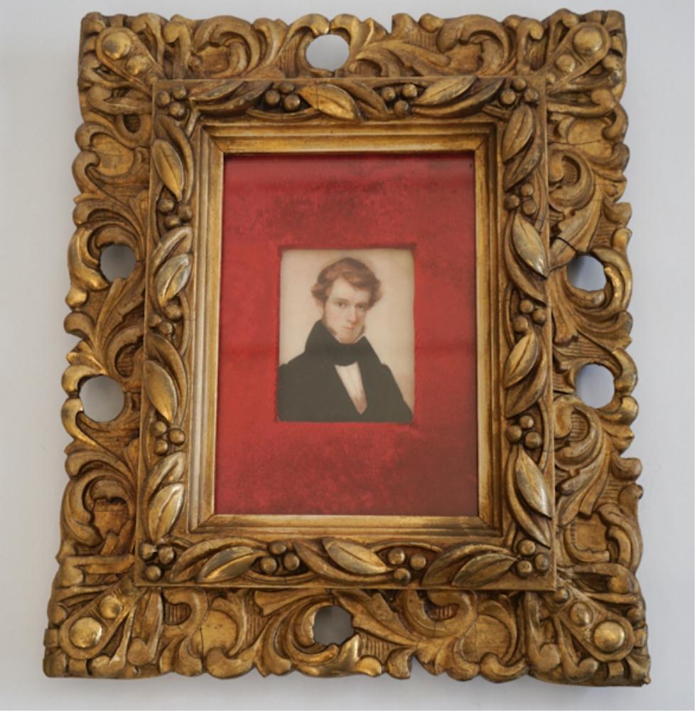 American or British School: Early 19th century. Portrait miniature of a young man in well dressed attire housed in a handsome carved and gilt frame. H10 1/4" W8 1/2" Sold from the collection of Bobby Carpenter and Dr. Garrett Sa