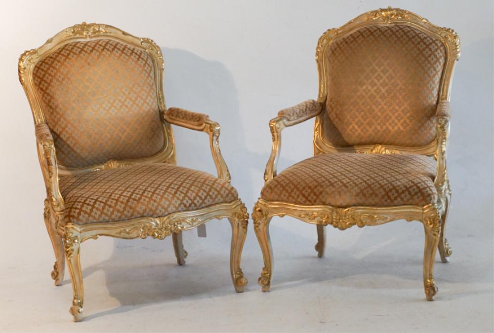 Pair French Carved & Polychrome Easy Chairs: Early to mid 20th century. Having a well carved, gilded and polychrome frame with upholstered back and seat. H44" W31" D28" Sold from the collection of Bobby Carpenter and Dr. Garrett Saikley.