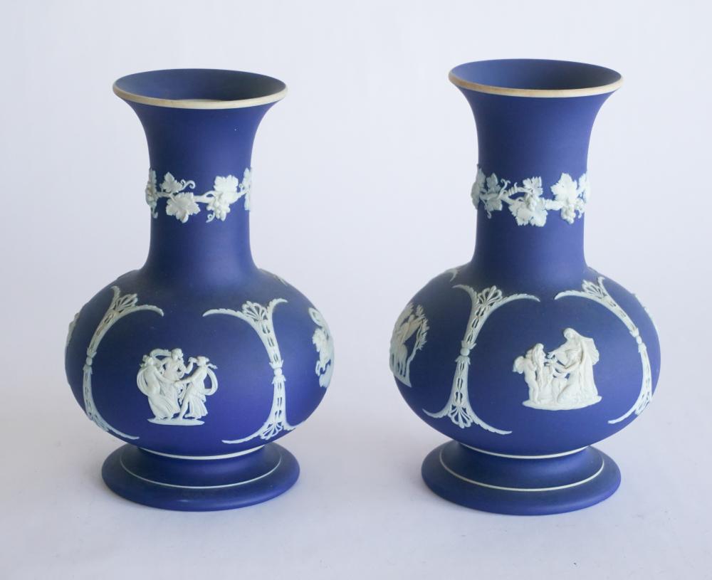 Fine Pair Wedgwood Porcelain Jasperware Vases: 19th century. Having a striking form with flared rim above bulbous body atop flared foot the body adorned with excellent classical decoration. Good condition. H8" W5 1/4" Sold from the Estate of Mr. C