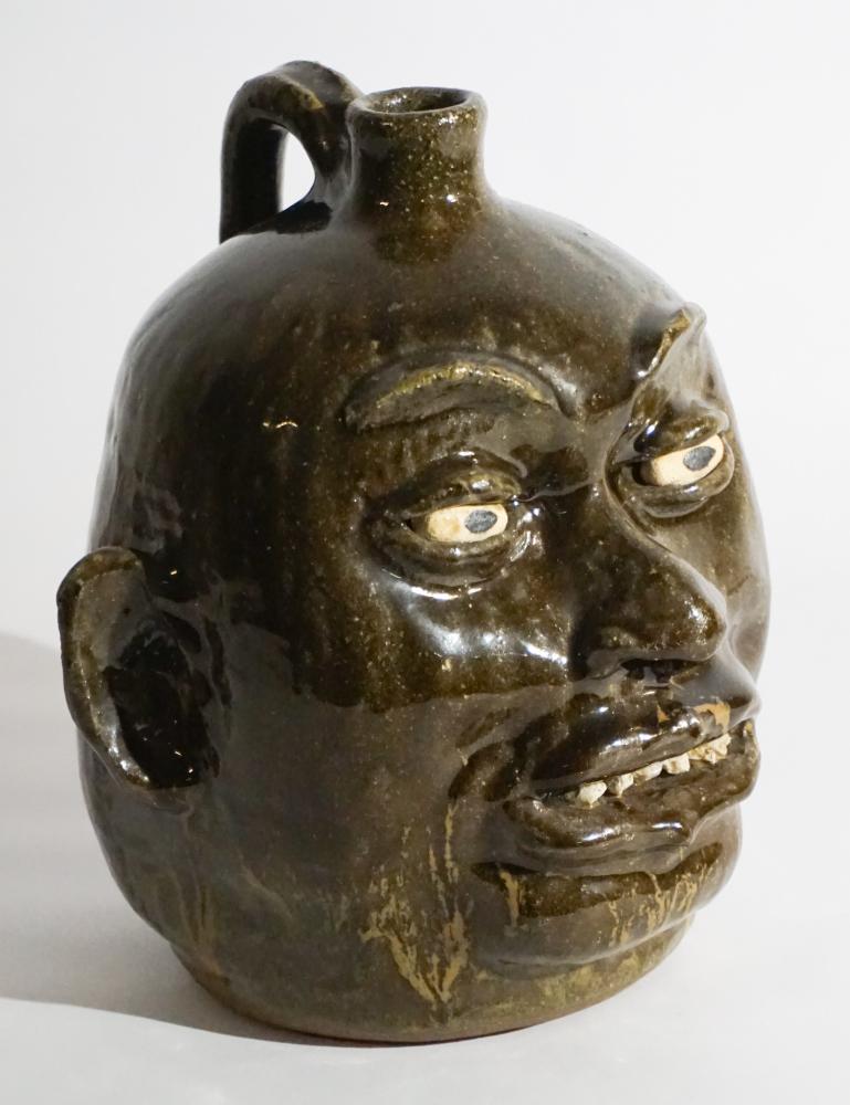 Excellent Southern Stoneware Rock Tooth Face Jug: Lanier Meaders working in Mossy Creek, Georgia (1917 -1998) The exceptionally sculpted and alkaline glazed face vessel having nicely defined characteristics and uncommon rock teeth. Excellent conditio