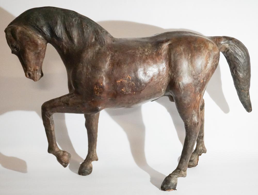Antique Leather Horse Foot Stool or Side Piece: Likely British and possibly by Abercrombie and Fitch. The handsome leather standing horse having a nice old surface and strong stance. The piece has glass eyes as well. H27" L32 1/4" Sold from the col
