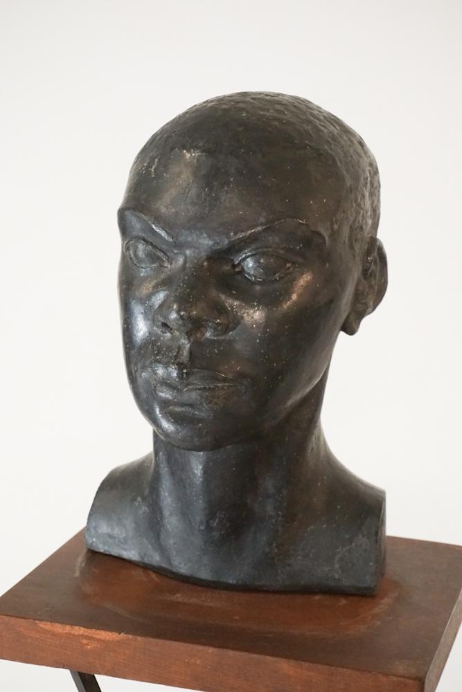 Constance Meriwether Sheen: (Ohio/Arizona/South Carolina, 1914-1979 The work having been exceptionally sculpted and cast in iron. Very well detailed example having a nice old patanized surface. The piece rests atop its stand wit