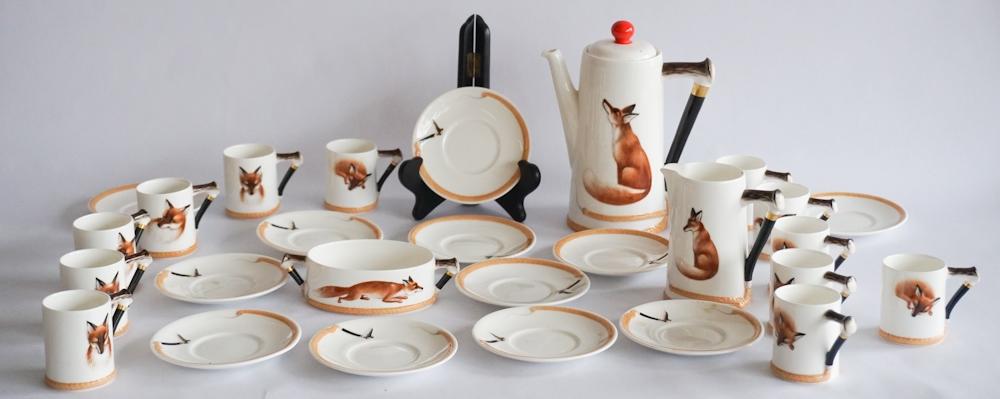 Royal Doulton Reynard The Fox Bone China Tea Set: 20th century, England. Very charming set including a teapot, cream and sugar and twelve cups with saucers. All in very good, well kept condition throughout. Sold from the collection of the late Lita "