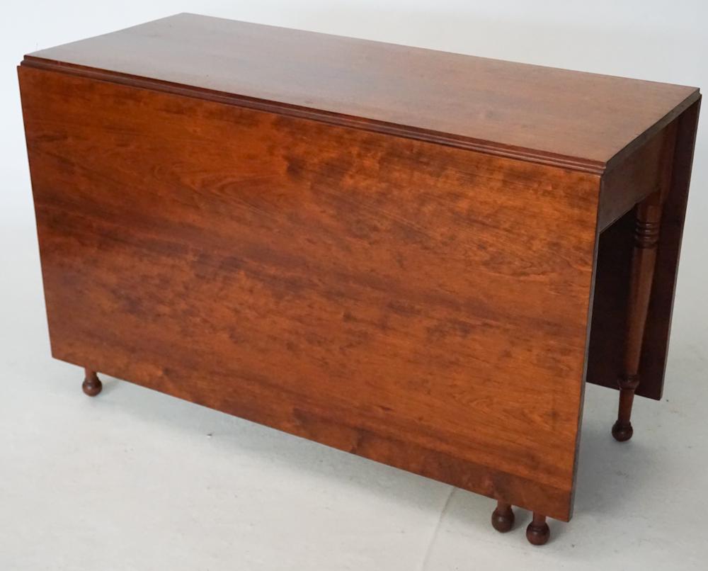 American Federal Cherry Wood Drop Leaf Dining Tabl: Circa 1820. Having a fine grain to the top and the leaves above turned wood lower legs. H29" W21 1/4" D45 1/2" Sold from the collection of a Pawleys Island, South Carolina lady.