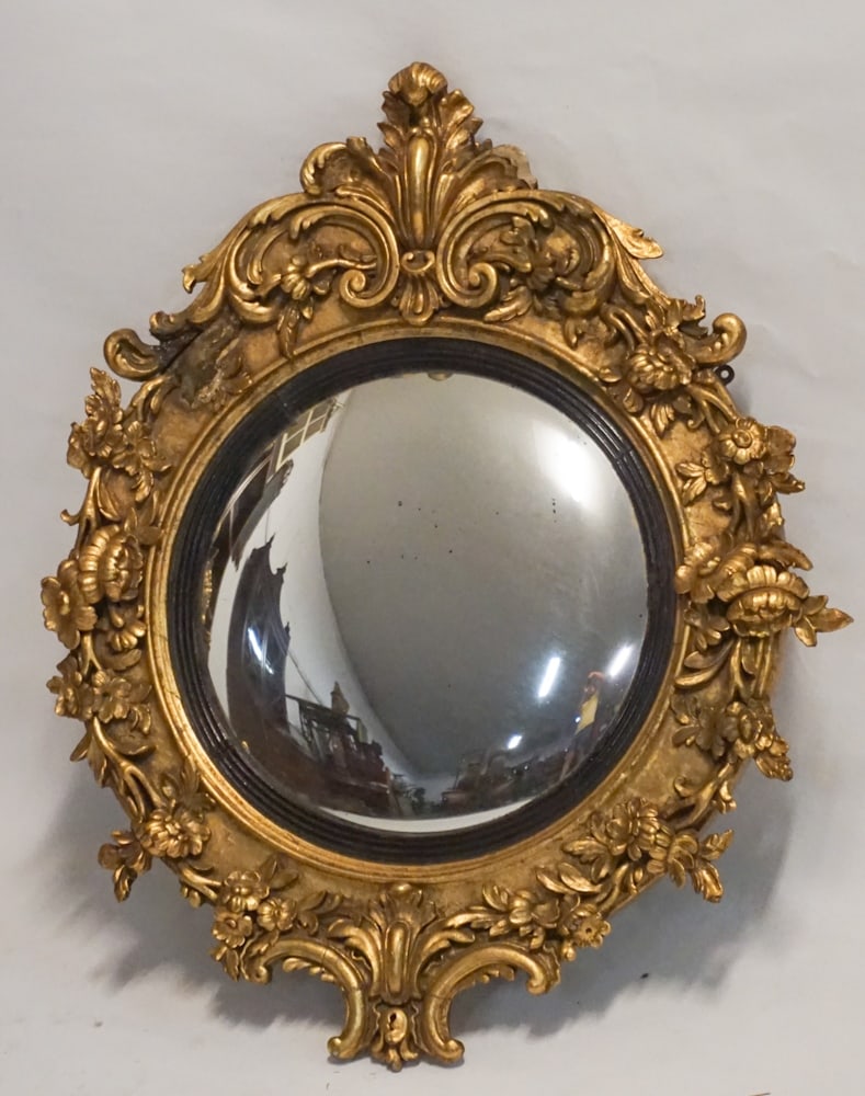 British Regency Carved & Gesso BullsEye Mirror: Circa 1840. Having a fine and intricately formed frame with quality gilded surface centered by convex looking glass. H36" W32" Sold from the collection of a Georgetown, SC gentleman.