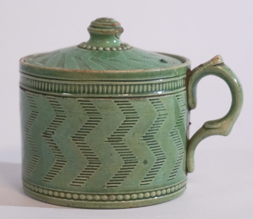 Antique Engine Turned Staffordshire Pottery Cup: Early 19th century, England. The piece having a nicely decorated lid and body with profuse decoration. The glazed is a fine lead copper green. The lid has a small loss otherwise nice overall condition