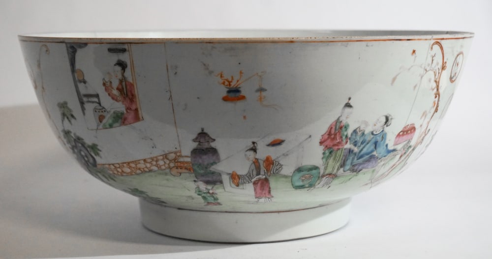Antique Chinese Famille Rose Porcelain Punch Bowl: Early 19th century. Having a fine size and nicely decorated. The bowl has been staple repaired at some point in several areas. The piece is stable for display and an interesting example. H7" W16" Sold