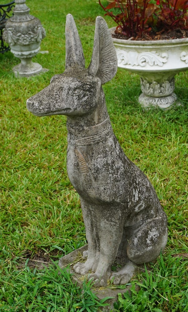 Excellent Vintage Cast Stone Garden Hound: Elegantly seated Pharaoh hound. Very nice early surface throughout. Excellent form and patina. Slight loss to the base but otherwise good condition overall. H33 3/4" Sold from the collection of a Colu