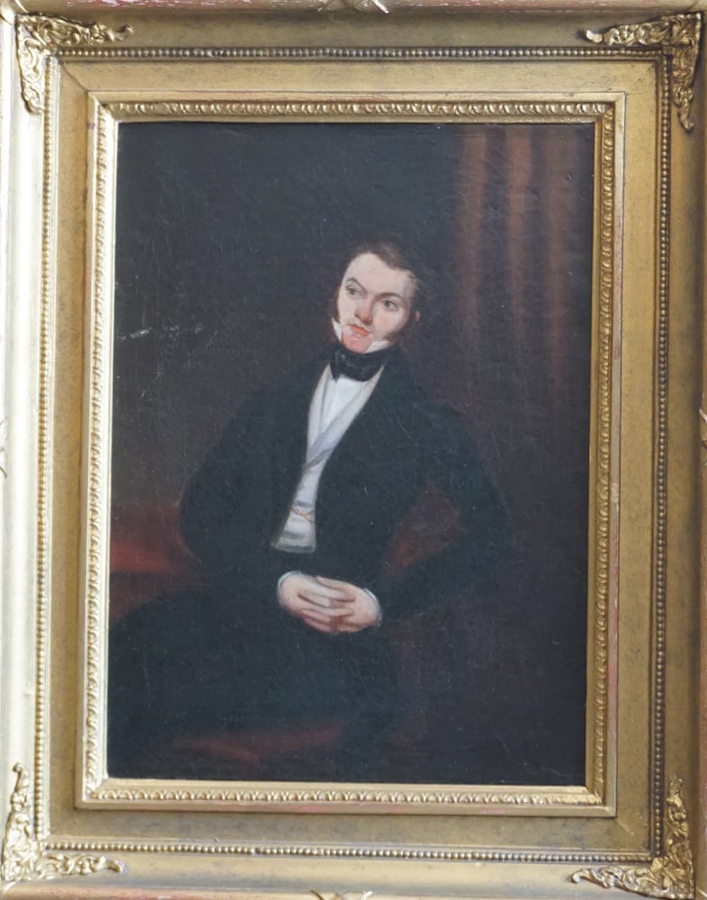 British or American School: Mid 19th century. Portrait of stately young man sitting in a well appointed setting. The work having been backed with board at some point. No apparent signature detected. Framed nicely. Framed: H19 1/