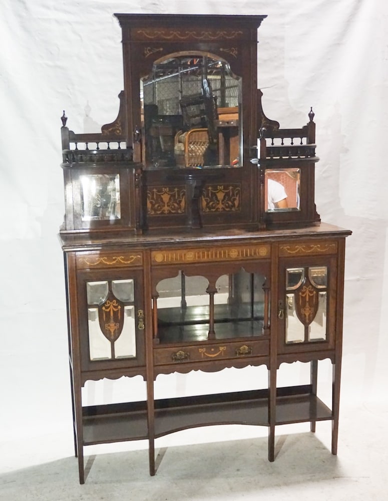 British Edwardian Inlaid Rosewood Sideboard: Circa 1890. Having a brilliantly inlaid case centered by beveled looking glass flanked by gallery at left and right also atop beveled glass lower paneles and centered by brilliantly satinwood inlaid p