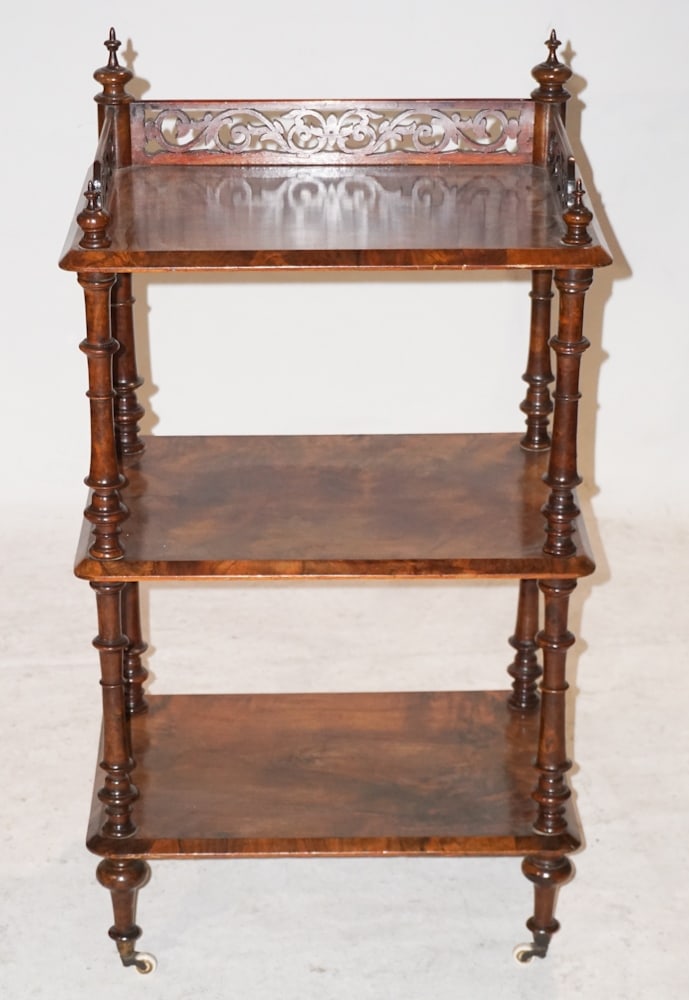 English Rococo Style Carved Rosewood Etereger: Circa 1870. Having a nice scrolling upper gallery with charming turned wood frame and three well figured shelves atop a pronounced turnip foot. H37 1/2" W22" D14" Sold from the collection of Jean and 