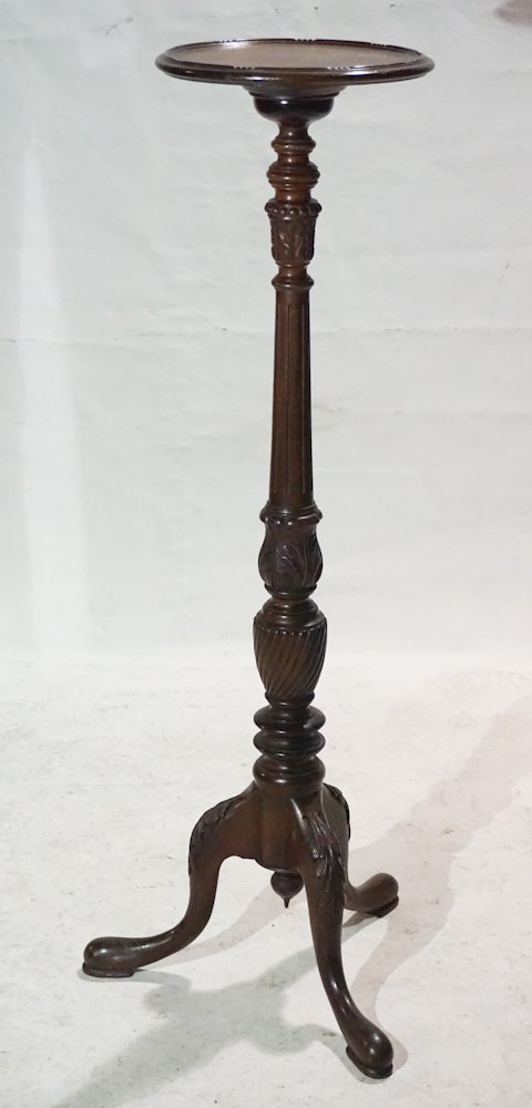 George III Style Mahogany Plant or Display Stand: 19th or early 20th century. Having been well crafted with dish top above very nicely carved frame with charmingly carved urn at lower body all resting on three acanthus carved legs ending in a pad foo