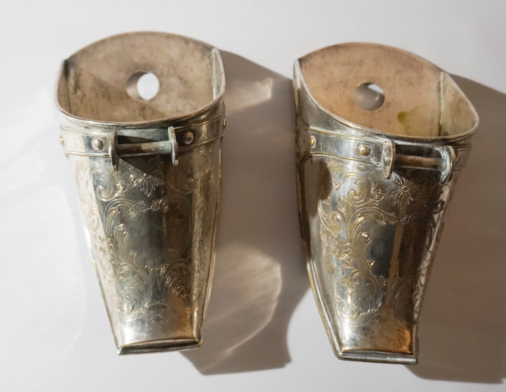 Antique South American Silver Plate Horse Stirrups: Each marked Mesa at the underside. Each is very nicely chased by hand and in good overall condition with some slight bleed consistent with age. L10" Sold from the collection of Jean and Steven Rothroc