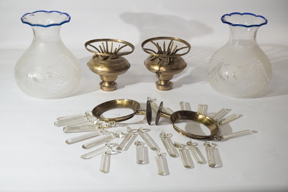 Pair Neoclassical Brass & Crystal Wall Sconces: Mid to late 19th century, likely English. The handsome pair of fluid lamp all sconces having frosted and cut to clear blown glass shade with blue rim over the body with fluid chamber below and hung wi