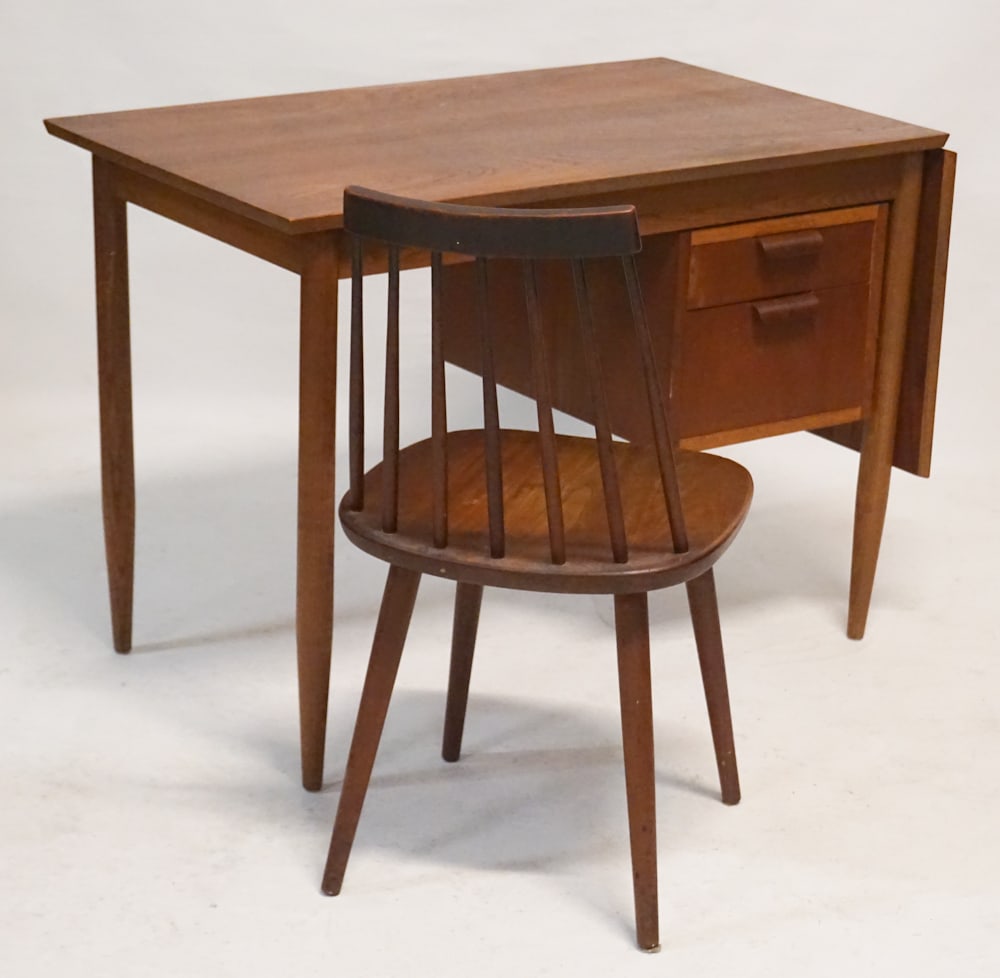 Fine Swiss Mid Century Teakwood Desk & Chair: Circa 1960. The piece having a very interesting sliding top with drop leaf that makes the desk 18" longer when needed and when not in use hangs nicely at its side out of the way. The charming desk is 