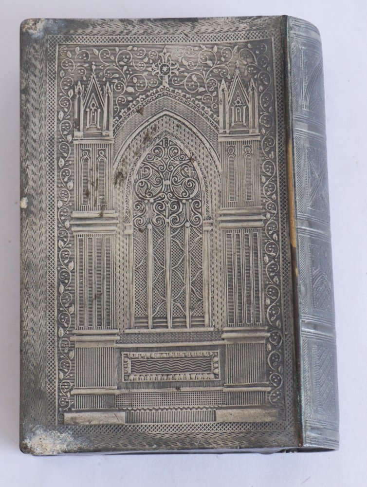English George III Pewter Book Box: Circa 1825. Having been nicely formed in the gothic style with well sculpted surface. Nice patina throughout. W4" H5 1/8" D1 1/2" Sold from the collection of an upcountry, South Carolina lady and gent