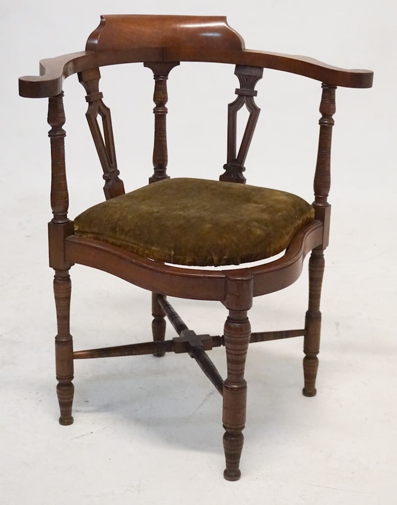 Renaissance Revival Carved Walnut Corner Chair: Circa 1860, America or England. Having a carved backrest with nicely turned frame and upholstered seat. H32" W26" D26"