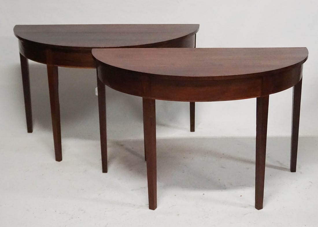 Pair Federal Black Walnut Demilune Banquet Ends: Circa 1810. Having D form top over nicely figured freeze all atop four tapered legs. H27" W48 1/2" D24" Sold from the collection of a Charleston, South Carolina family.
