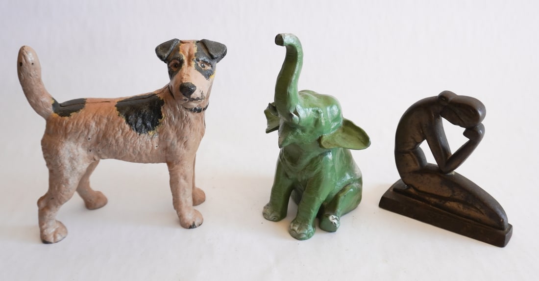 Collection Antique Iron Doorstops: 19th and early 20th century group including a jack russell terrier, a seated elephant and an art nouveau figure of a woman. Tallest: H8 1/4" Sold from the collection of a Camden, Arkansas gentleman.