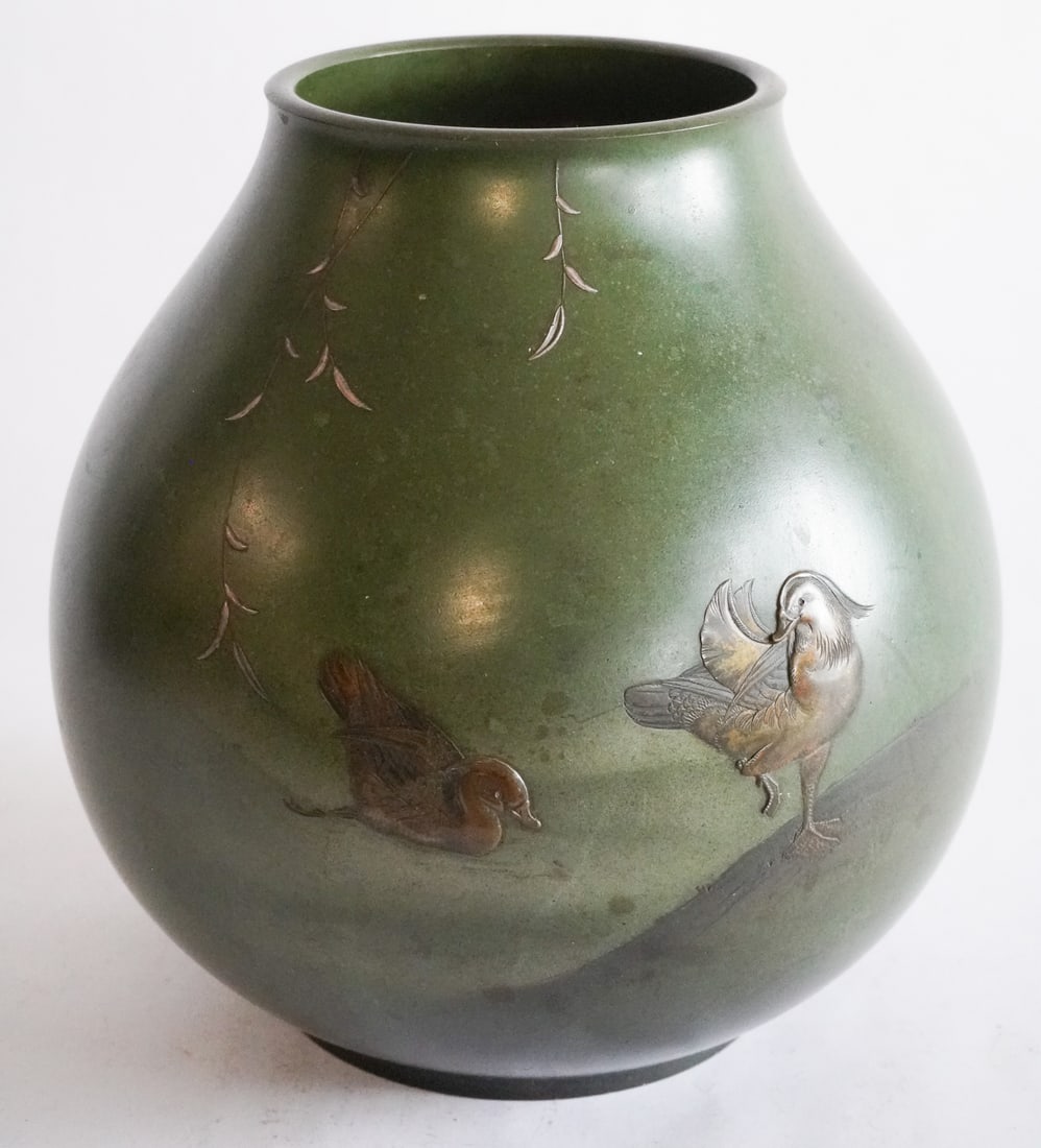 Excellent Antique Japanese Meiji Period Bronze & Silver Centerpiece or Vase: Circa 1890. Having been exceptionally crafted in bronze with inset figures of ducks having been meticulously hand sculpted and with vines stretching from rim into body in sterling silver. Excellent pa