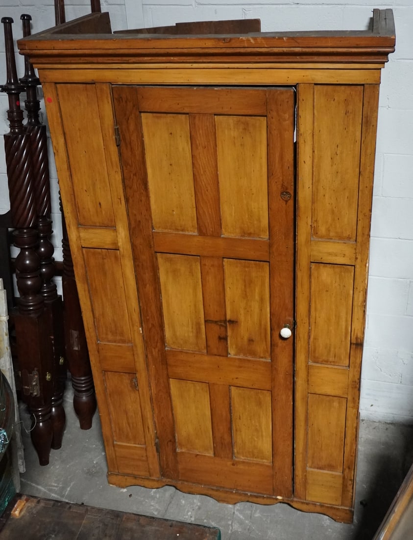 Antique Country Federal Poplar Wardrobe: Circa 1820, likely Virginia or Pennsylvania origin. Handsome cabinet having a molded crown over paneled case within single hinged and paneled door opening to interior all atop a nicely shaped foot. H8