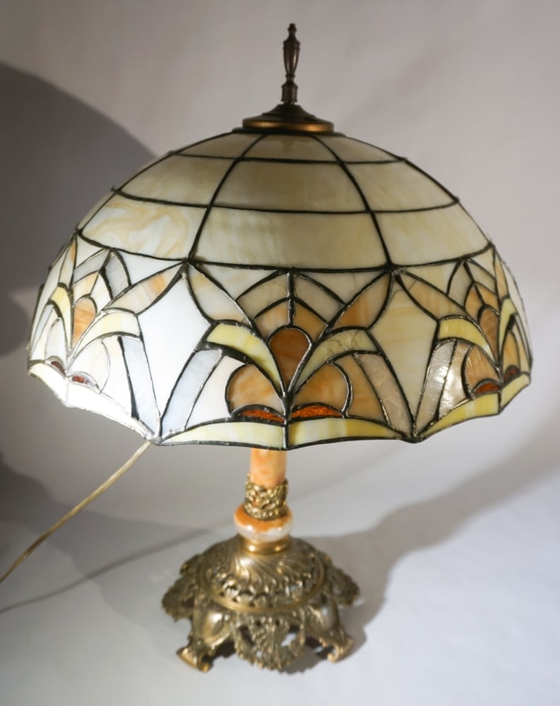 Arts & Crafts Leaded Glass Brass & Onyx Lamp: Circa 1930. Having a fine leaded glass shade with onyx and brass base which is nicely formed. The shade has some scattered hairlines but overall original condition. H23 1/2" W18" Sold from the collect