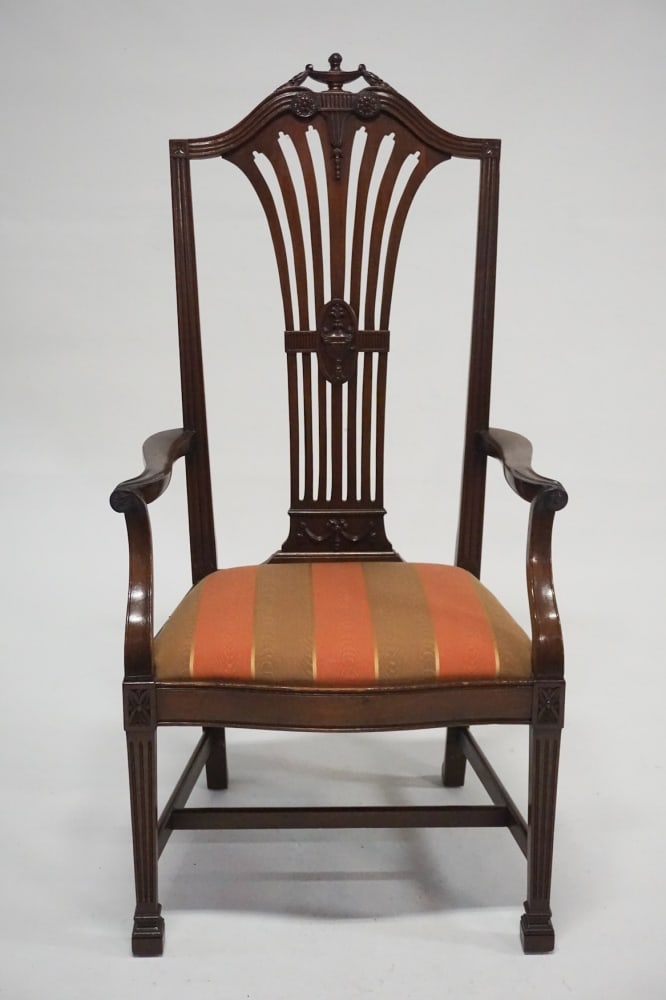 George III Style Mahogany Governors Armchair: Circa 1900. Edwardian period chair of a large size. The piece having nicely carved back and arms over a well upholstered seat all atop tapered and fluted legs. H52 1/2" W27" D22" Sold from the collect