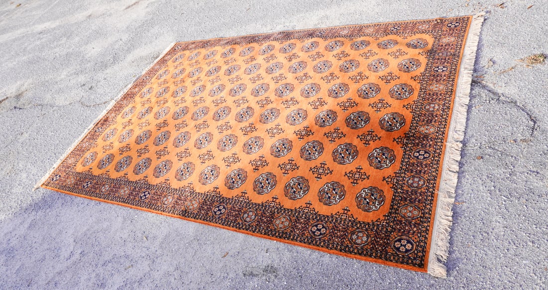 Antique Persian Bukharah Carpet: Mid 20th century. Having nice rich golden brown color with a fine weave. Good well kept condition. L171" W118" Sold from the collection of a South Boston, Virginia family.
