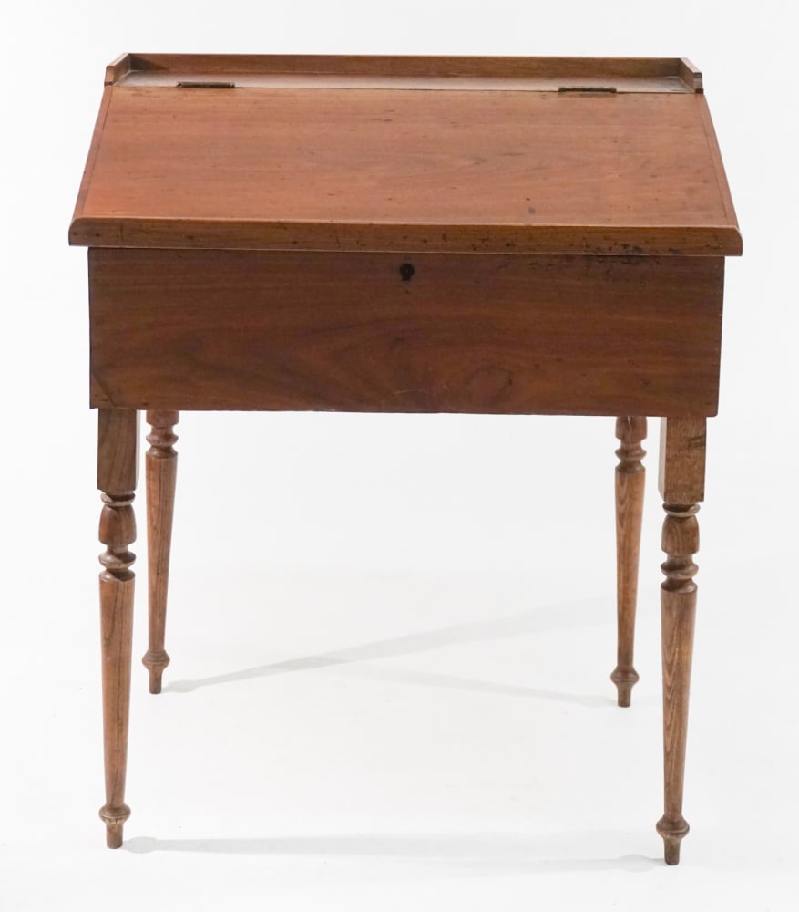 Southern Country Federal Mixed Wood Planters Desk: Circa 1840. Having a nice form with hinged front and fitted interior over inset turned wood legs. H39 1/8" W32" D22" Sold from the collection of a Marietta Georgia gentleman.