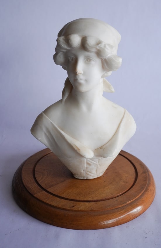 Italian School: Late 19th century. Sculpted marble bust of an Italian woman having been well rendered and the work is signed at the backside. H12" (including stand) Sold from the collection of a South Boston, Virgini