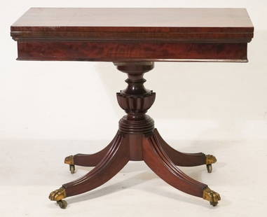 Very Handsome Southern Federal Carved & Figured Mahogany Games Table: Attributed to John NeedlesCirca 1815-20, Baltimore Maryland. Brilliantly figured top comprised of one board each hinged to swivel and open as gaming surface over the very handsomely carved base leadin