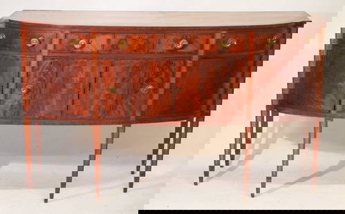 Very Handsome American Federal Inlaid Mahogany Sideboard: Circa 1790-1810, Boston. Excellent form having brilliant grain at the top and case housing three drawers over hinged doors the center of which are flanked by two excellent bottle drawers. The case boa