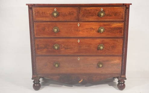 Handsome English Regency Yew Wood Inlaid & Carved Chest of Drawers: Circa 1825. Having a fine figured and shaped top with molded edge over the handsomely grained case housing two over four drawers flanked by turned trim and with brass pulls all atop turned feet. H44 1