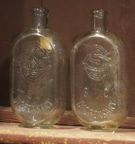Two Antique South Carolina Dispensary JoJo Flask Bottles