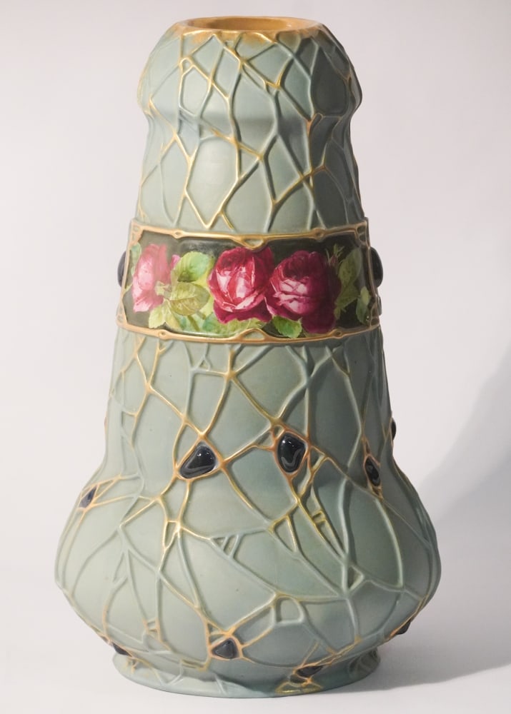 Large Austrian Amphora Holly Porcelain Vase: Striking example having large size and floral decorated center band. Marked at the underside. Good overall condition. H6 1/2" Sold from the collection of an Amelia Island, Florida Gentleman and Lady.