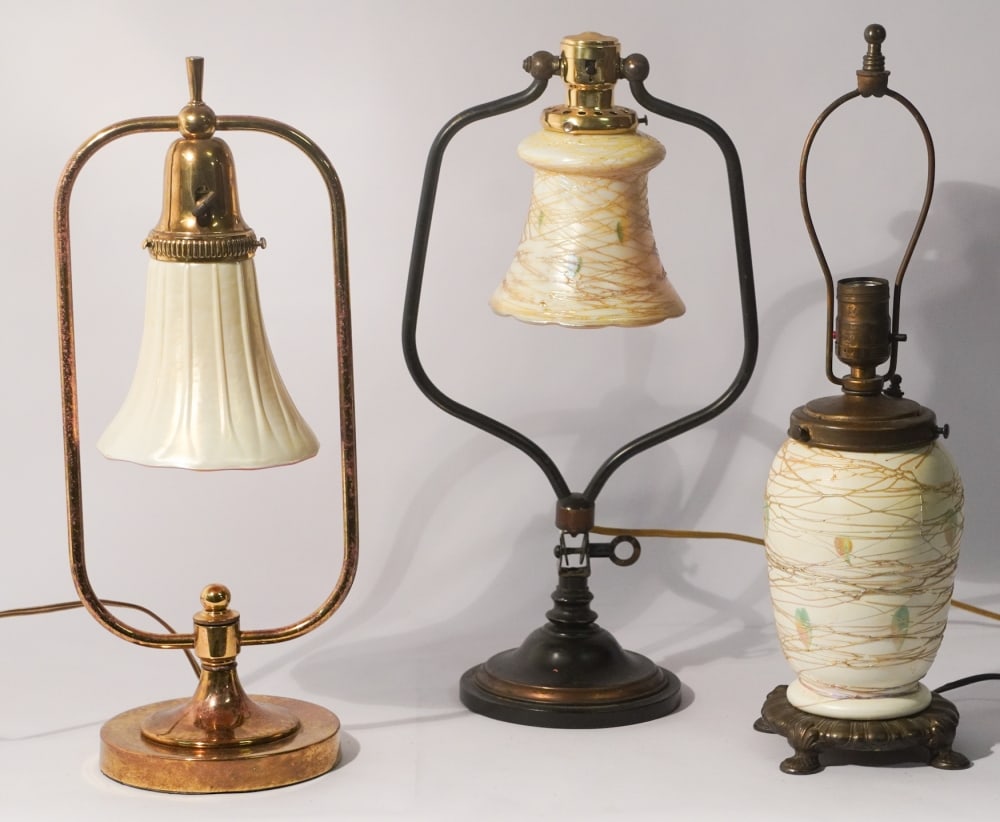Three Arts & Crafts Period Blown Art Glass Lamps: Likely Quazell or Stuben. Each very nicely formed and with rich colors throughout. Well kept condition ready to be used. Tallest total: H18 1/4" Sold from the collection of an Amelia Island, Florida G