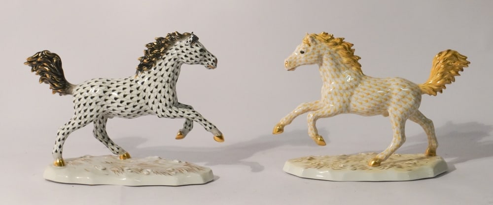 Pair Excellent Herend Hungarian Porcelain Stallion: Excellent examples, one in black with gold trim and the other in gold. Each in excellent condition. H7 3/4" L10 1/2" Sold from the collection of a Charlotte, North Carolina lady.