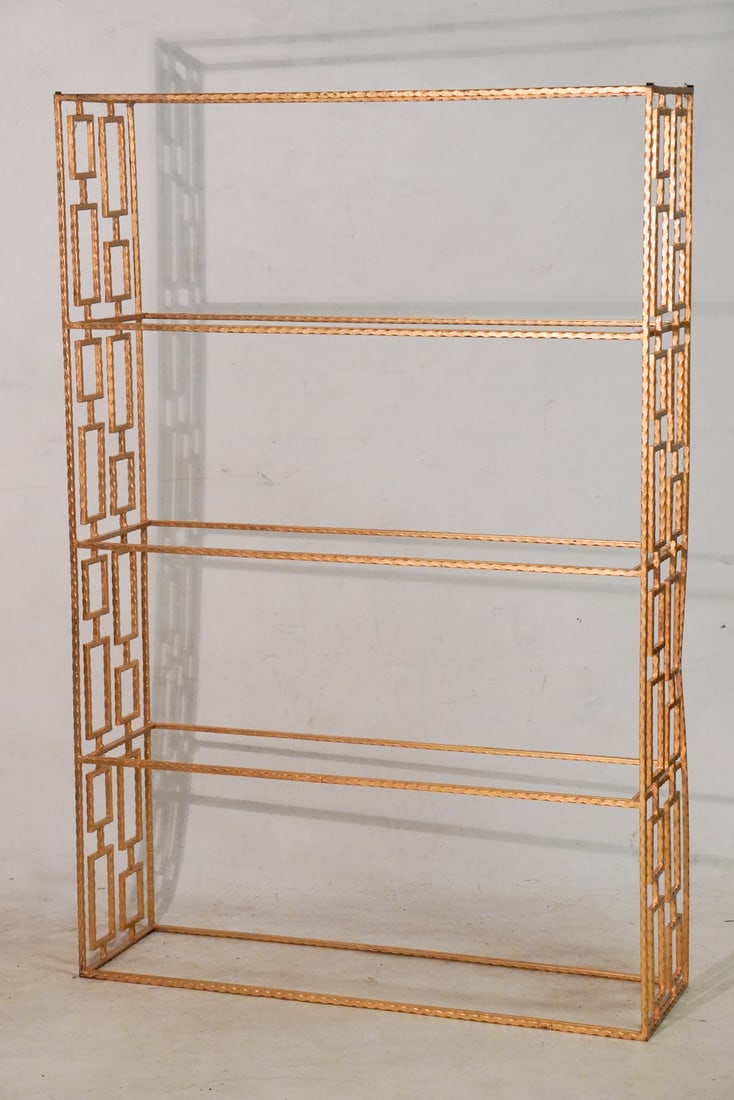 Gilded Iron Mid Century Display Stand or Shelf: Mid 20th century. Brilliant form having four even segments of shelves with brilliant surface. The glass shelves are not present but easily produced. H72" W47 1/2" D14 1/4"