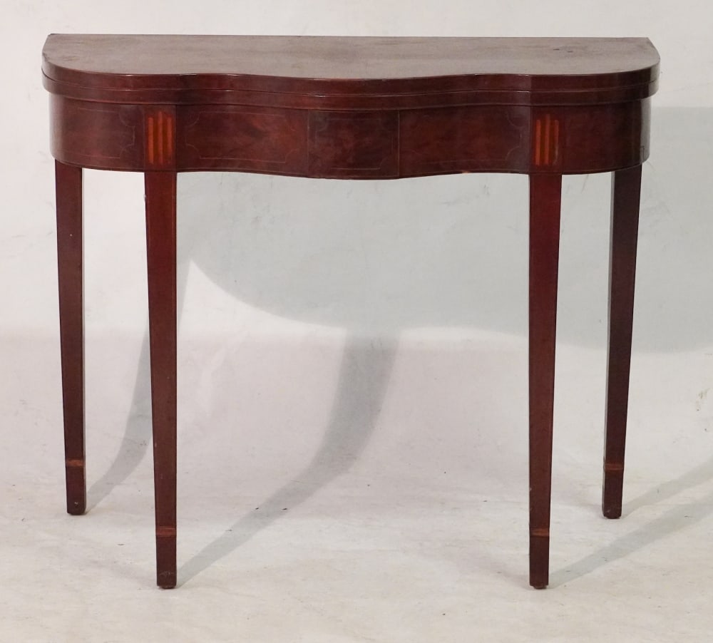 American Federal Inlaid Serpentine Games Table: Circa 1800, attributed to Philadelphia. Excellent form with very handsomely inlaid freeze and banded tapered legs. Very handsome example. H30" W36" D17 1/2" Sold from the collection of a Charleston, S