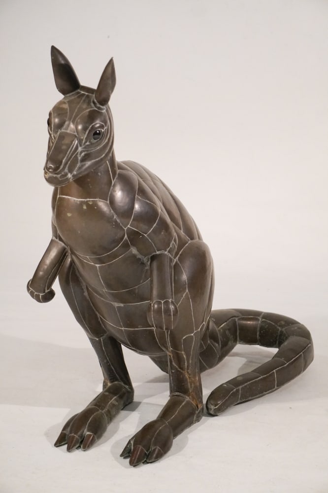 Charming Vintage Lifesize Kangaroo Copper or Brass Sculpture: Mid 20th century. Excellent lifesize example having glass eyes and brilliant patina. The piece is crafted in segments of metal. Weight is only approx 40lbs as it is hollow. H39" Sold from the collecti
