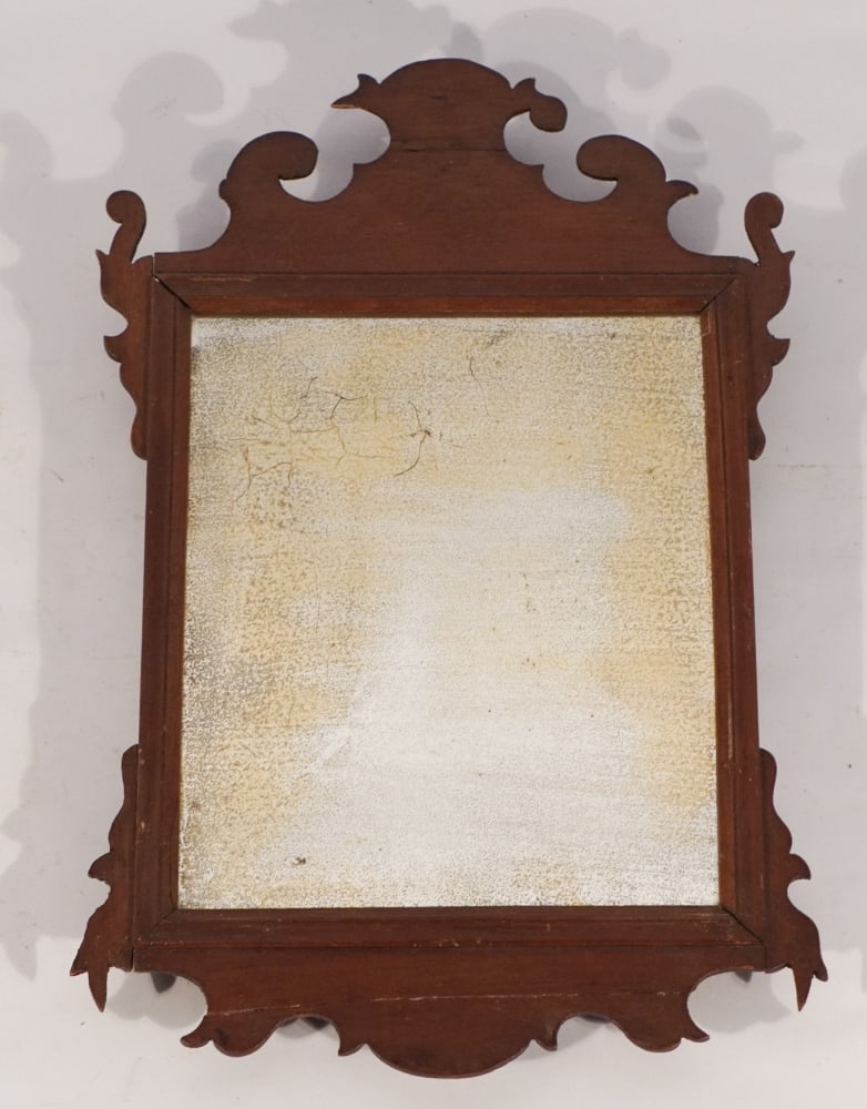 Federal Mahogany Looking Glass of Smaller Size: Circa 1790. Having brilliant smaller size with excellently shaped frame centered by fine early mirror likely original to the piece. Very nice well kept condition only a repaired crack to frame at uppe