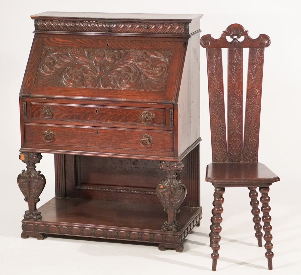 Handsome English or American Renaissance Revival Carved Oak Desk & Chair: Circa 1890. Having brilliantly carved case with fallfront opening to well appointed interior over handsomely carved legs. The desk accompanied by its handsome matching chair. H45 1/2" D19" W34" Sold f