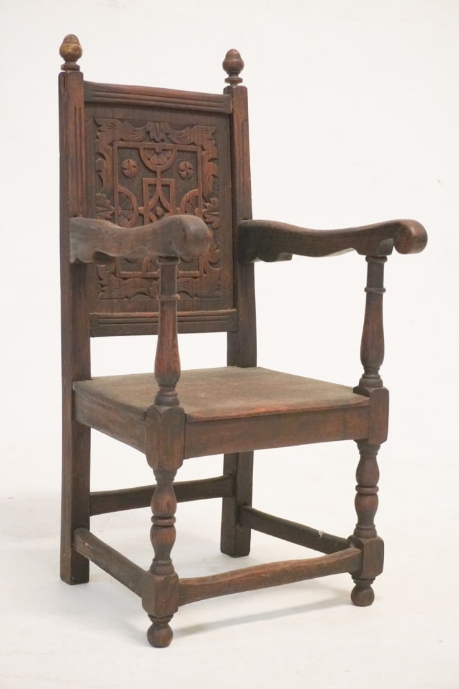 Period European Jacobean Carved Oak Altar Boys Arm: Chair Circa 1700. Having excellent form and proportions with handsomely carved and paneled back over plank seat with fine well turned frame. Oak throughout. H28" W13" D14" Sold from the collection of 