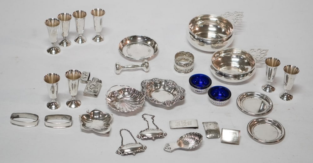 Collection Various Sterling Silver Tables Wares: Charming collection of various forms including a fine set of cherry stems along with decanter tags and lighter covers, two porringers and other forms. All sterling and in well kept condition. 702 gram