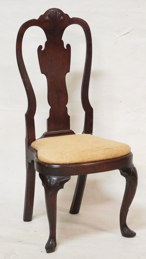 Exceptional Philadelphia Queen Anne Carved Walnut Balloon Seat Side Chair: Circa 1745. Having brilliantly carved back with shell crest over vase shaped splat and balloon seat frame on handsome shell carved legs ending in a slipper foot. H42" W20" D17" Sold from the collectio