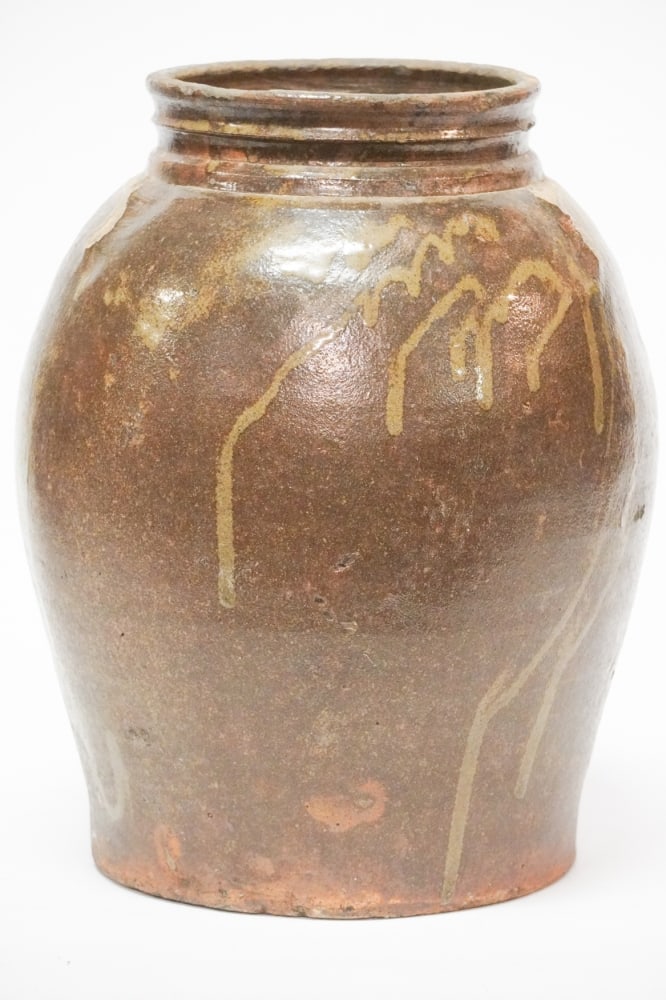 Southern Stoneware Edgefield District Storage Jar: Miles Mill likely by David Drake as the piece has a rim which is characteristic of David's throwing ridge. The piece has a brilliant runny chocolate alkaline glaze with incised lines at upper shoulder