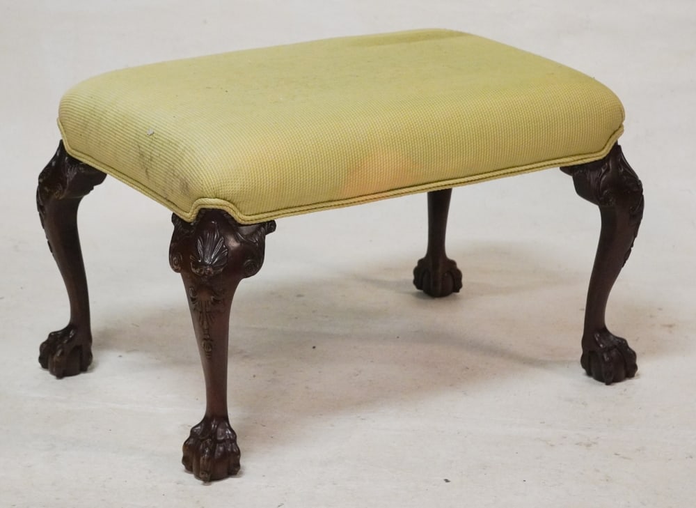 English Chippendale Style Carved Mahogany Foot Stool: 20th century. Stool having upholstered seat over nicely carved legs ending in ball and claw foot. H24" W32" D20" Sold from the collection of Vickie Murrell Dawson of Camden, South Carolina