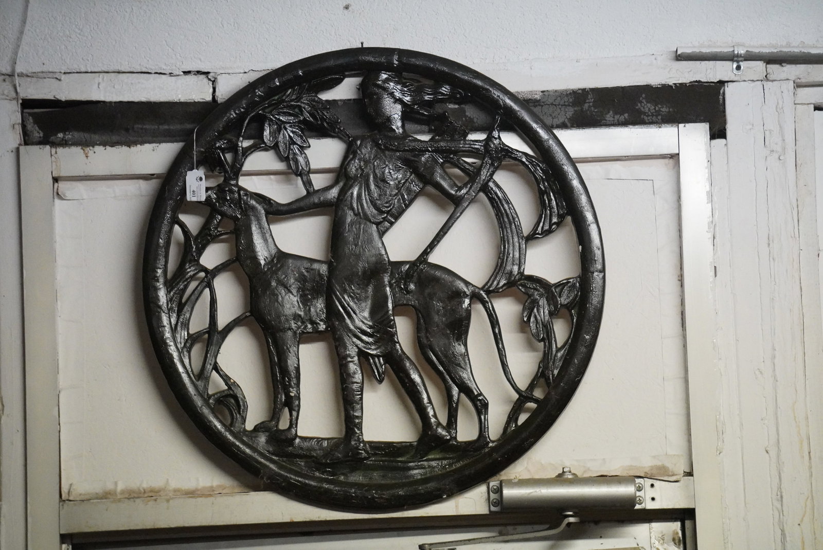 Art Deco Plaster Sporting Wall Hanger: Diana and the hounds, very charming circular wall hanger crafted of a molded plaster material. Some scattered restored hairlines at the backside. Very stable, ready to hang condition. H27" W27" Sold f