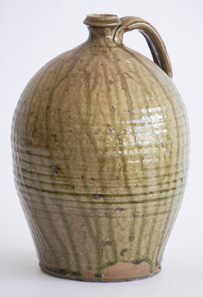 Exceptional South Carolina Upcountry Stoneware Jug: Circa 1850, attributed to Thomas Owenby, Union, South Carolina. Brilliantly formed and glazed example. The piece having nice ovoid form with well placed handle and strong glaze runs at all side. Small